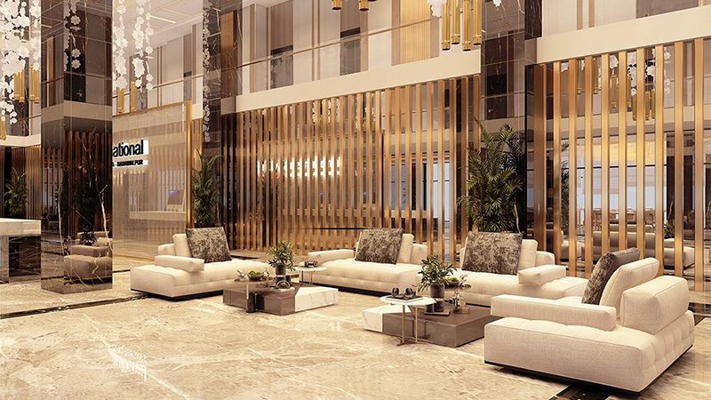 Hotel lobby seating area with cream sofas and timber screens