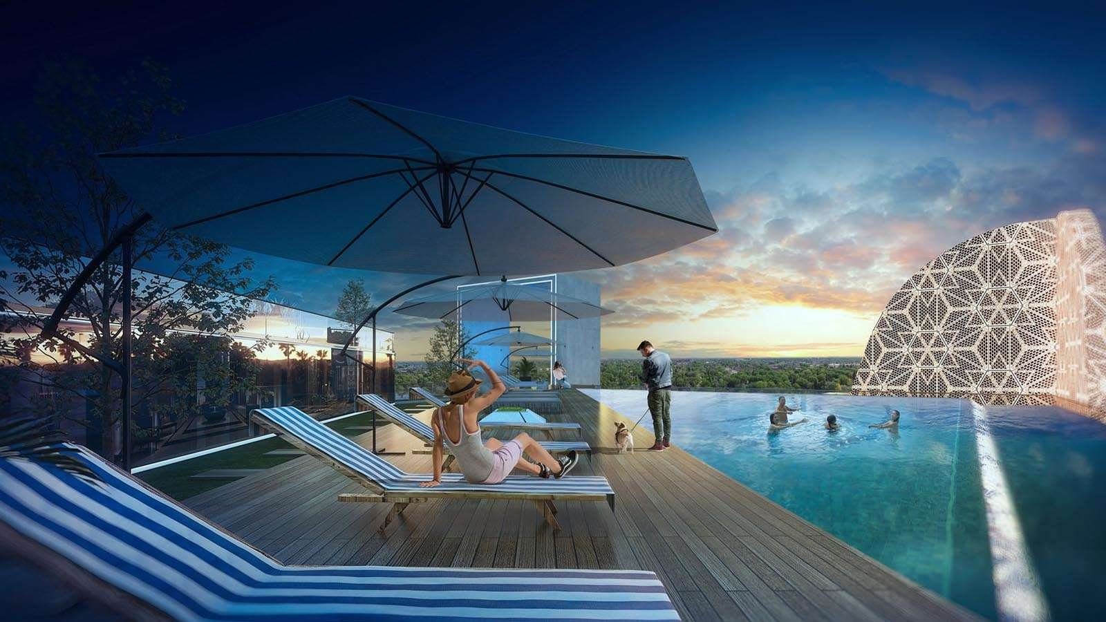 Rooftop infinity pool with sun loungers and umbrella